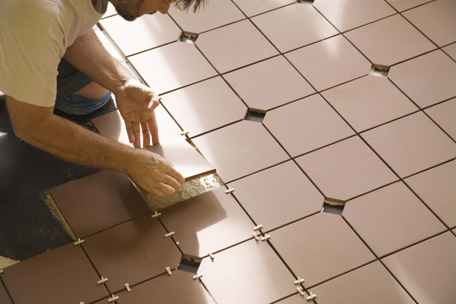 Installing-Ceramic-Floor-Tile-86464768-583ffd0d5f9b5851e5eac8c0[1]